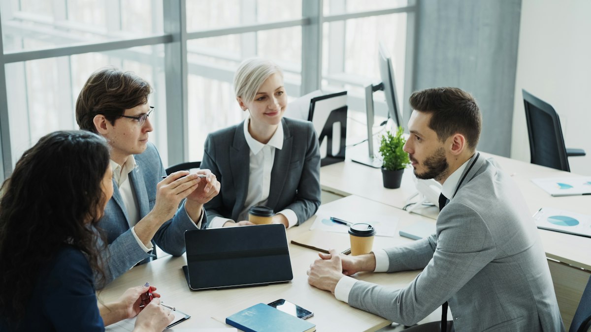 A team reviewing supplier options around a table